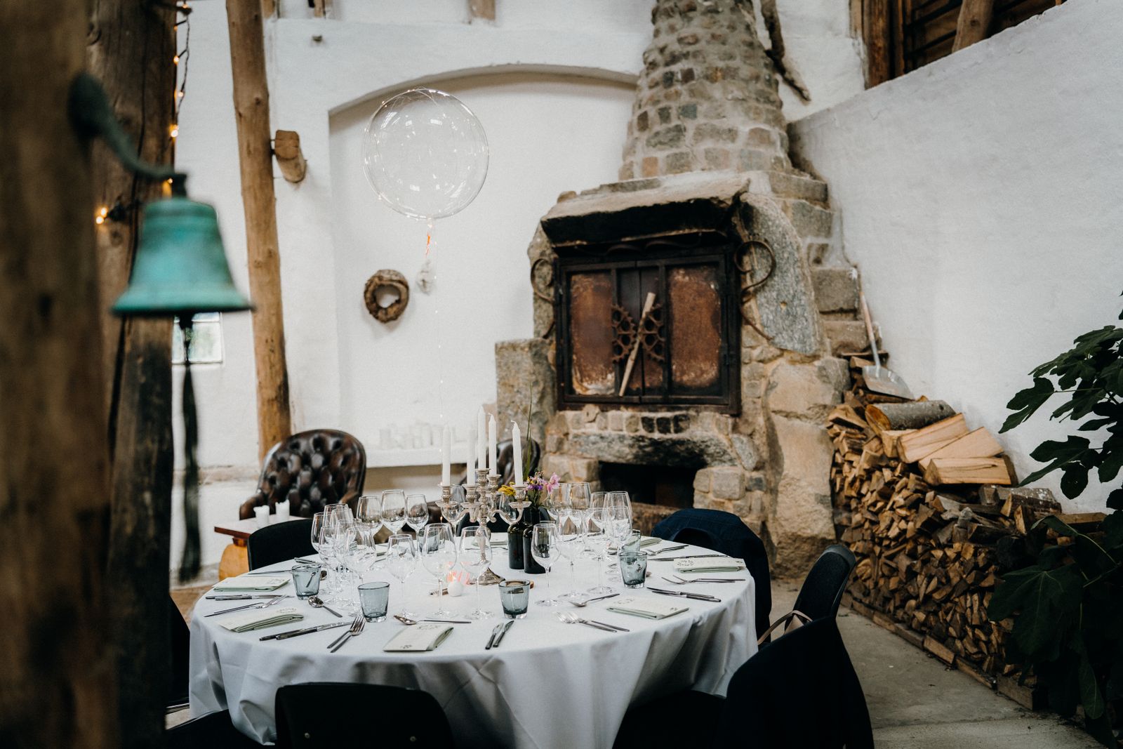 A table set by the fireplace at Timberline Table