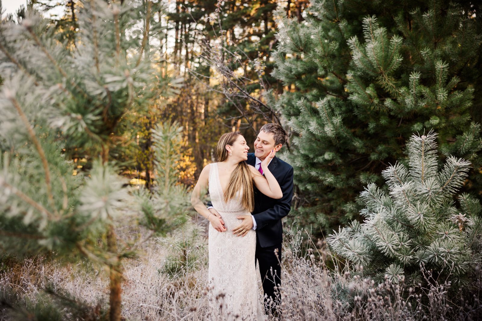 A couple in a pine forest